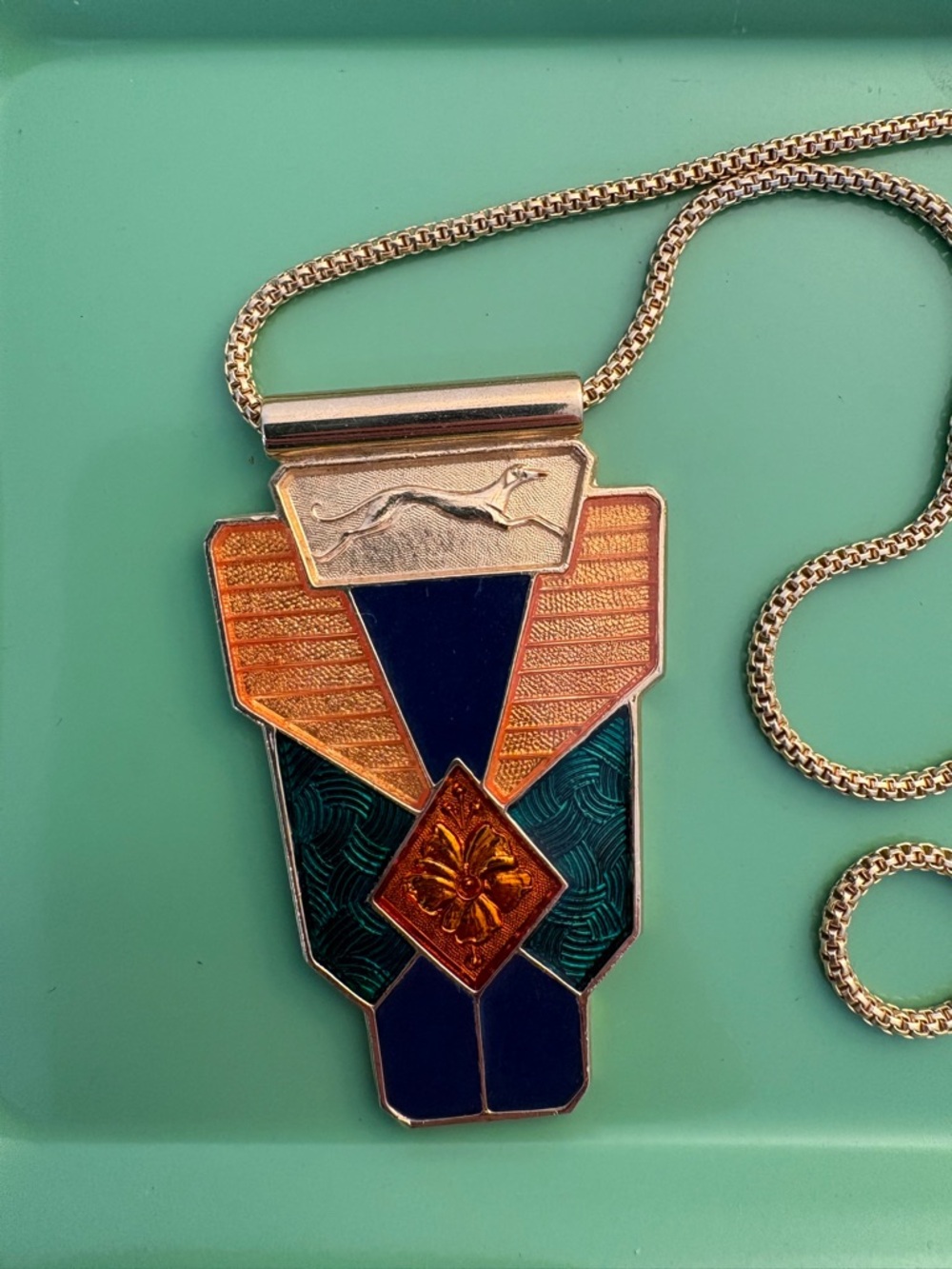 Unique vintage enamel gold-tone pendant necklace with greyhound motif